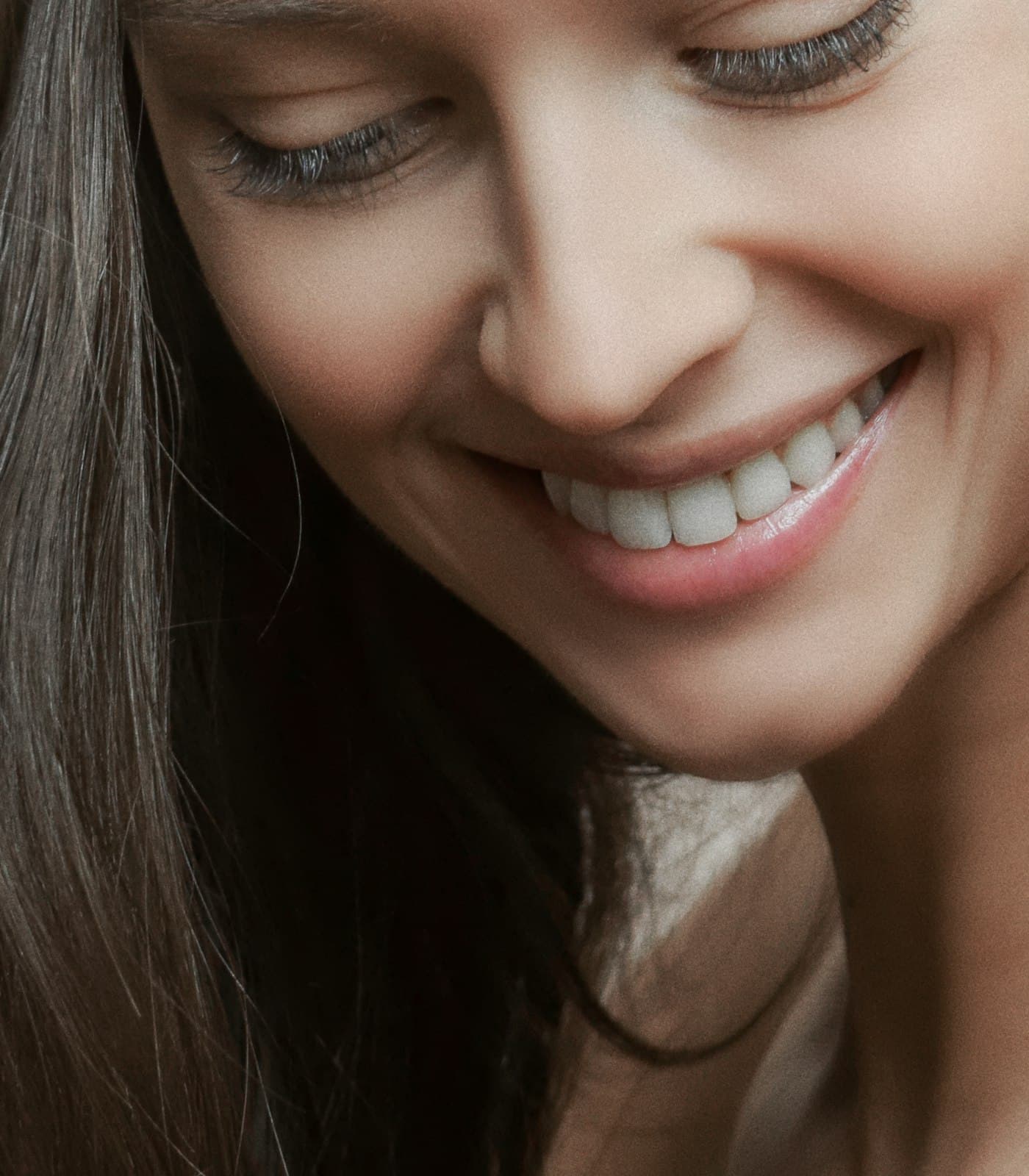 Client smiling after a teeth whitening treatment
